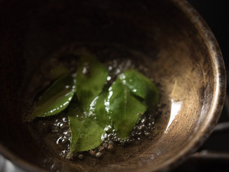 curry leaves added to the oil.