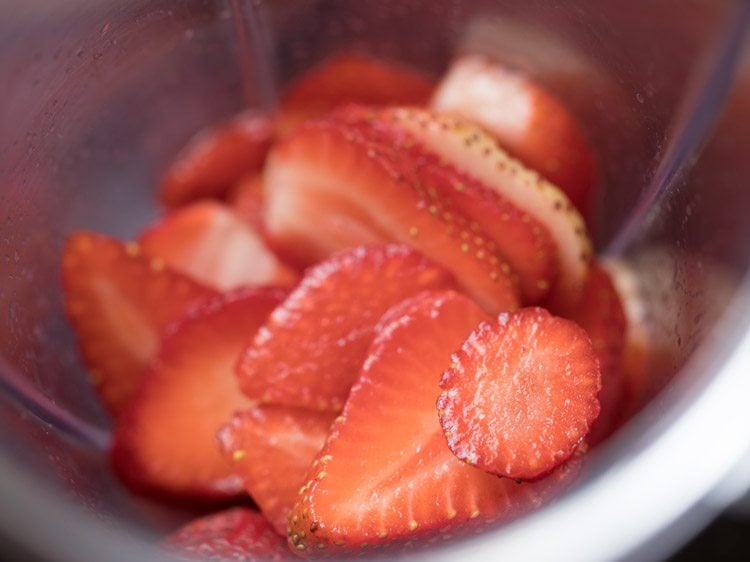 chopped strawberries in a blender