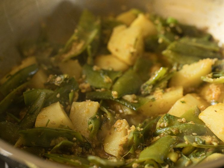 cooking aloo sem ki sabji. 