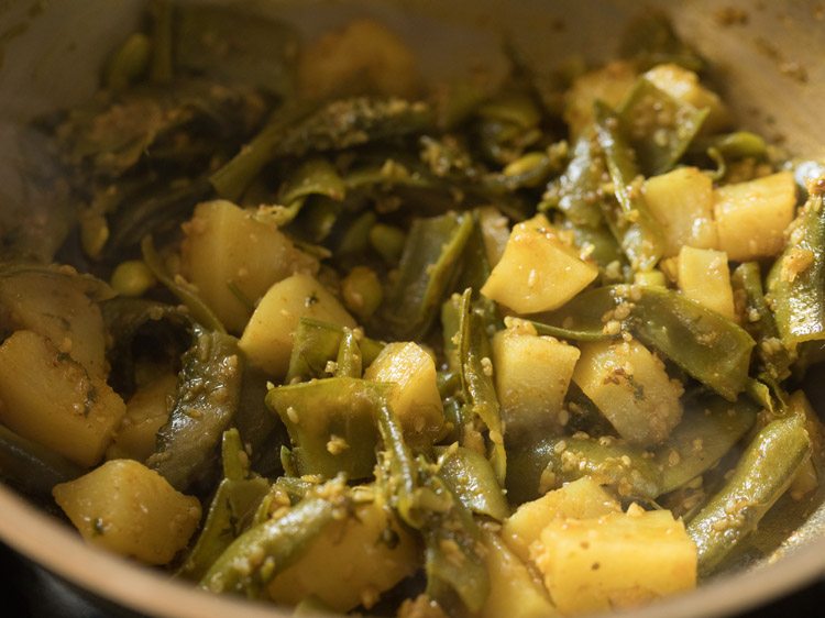 cooking aloo sem ki sabji. 