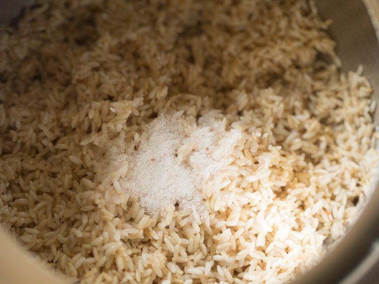 drained rice and salt added to a pressure cooker. 