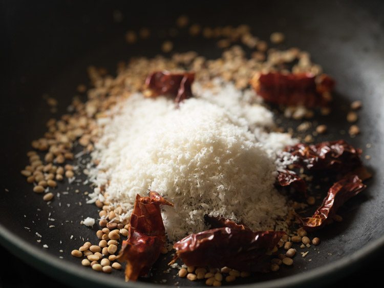 dried red chilies and desiccated coconut added to the urad dal. 