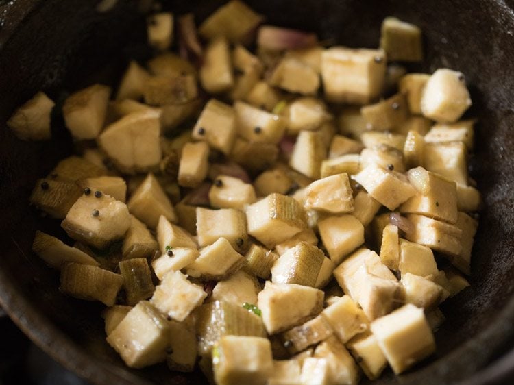 raw banana mixed well with the onions mixture. 