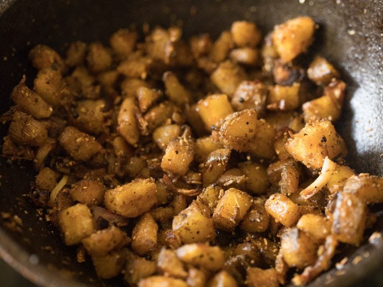 cooking raw banana till slightly crisp. 