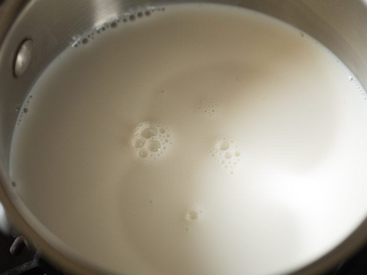 warming milk in a saucepan.