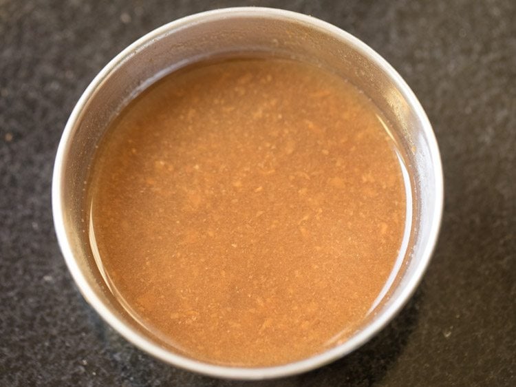 pulp extracted from tamarind in water for coconut milk rasam. 
