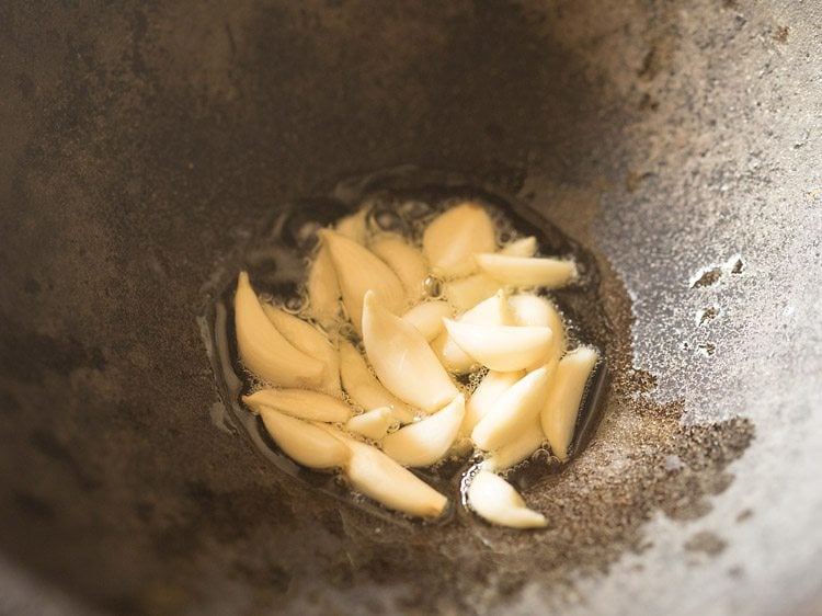 garlic cloves added to kadai.