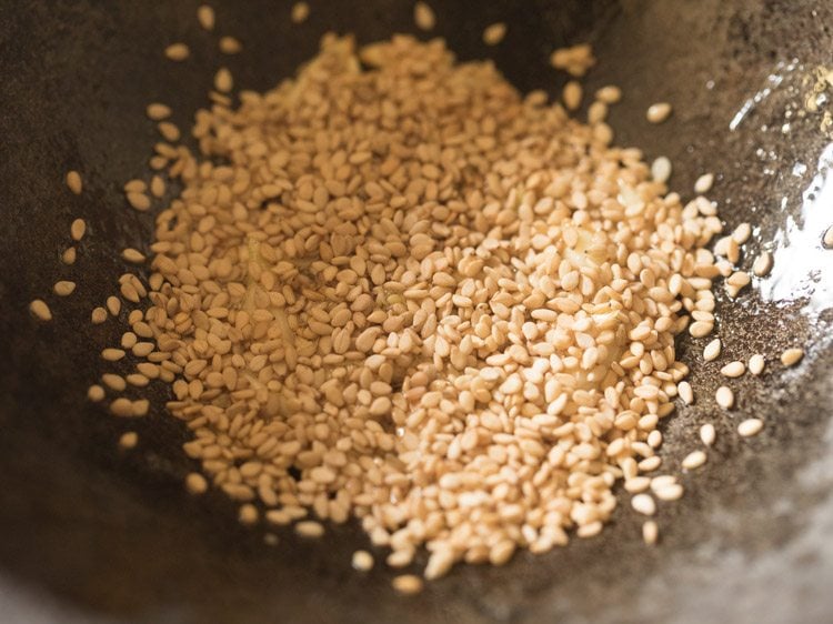 white sesame seeds added to the pan.