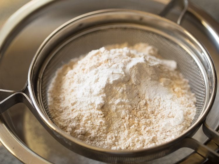 sifting flour and sugar in a sieve