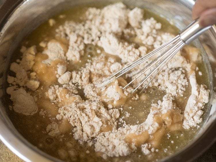 whisking wet and dry ingredients together