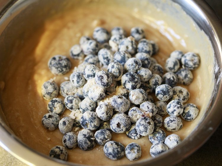 adding blueberries to the batter