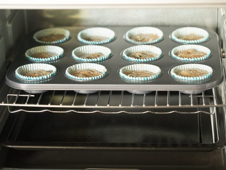 eggless blueberry muffins in the baking tray in the oven