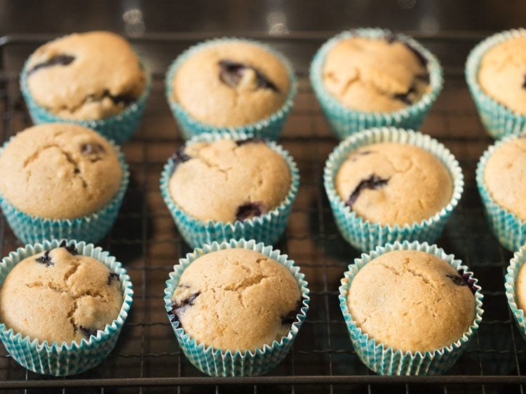 baked blueberry muffins on a wired rack