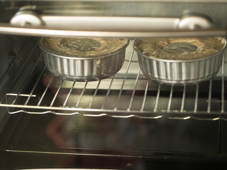 baking eggless sour cream coffee cake in two bundt pans.