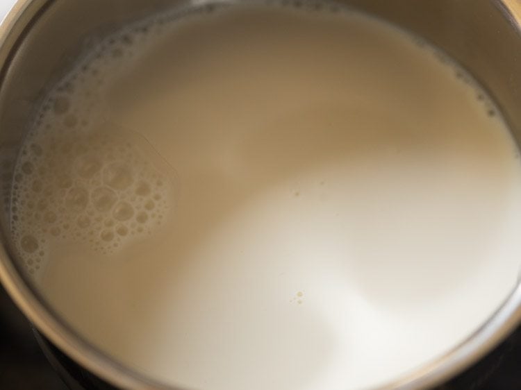 Closeup shot of milk in saucepan.