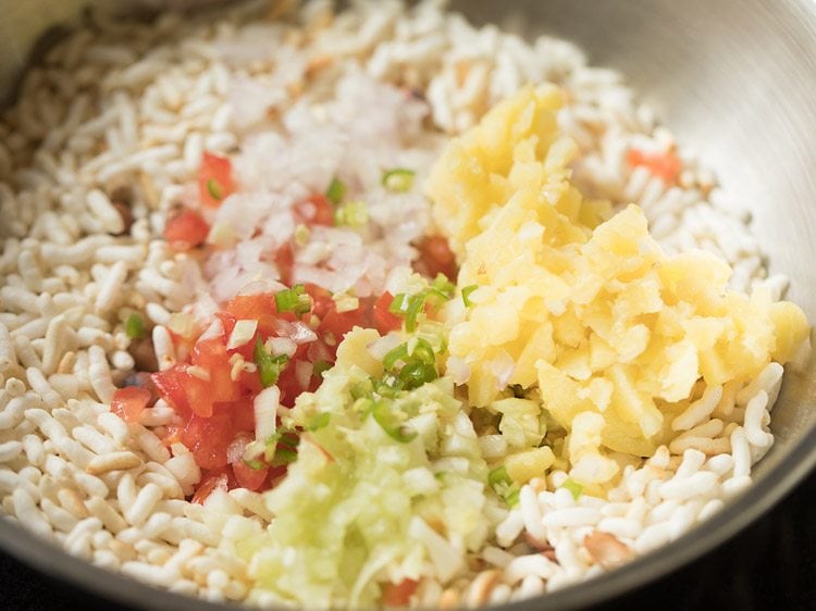 finely chopped ingredients added to spiced puffed rice. 