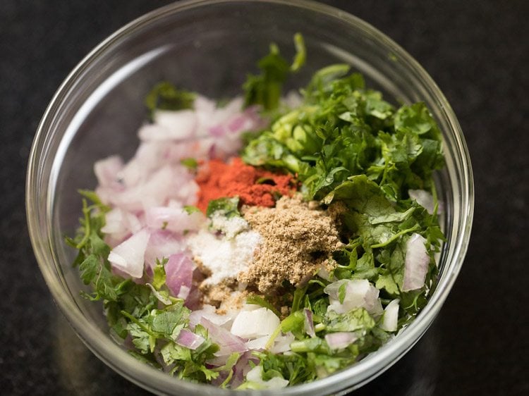 red chili powder, chaat masala powder and salt added to the bowl. 