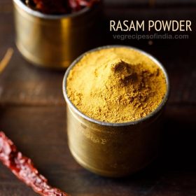 rasam powder in a brass container