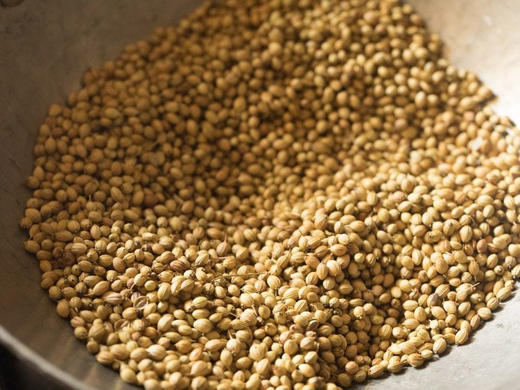 roasting coriander seeds in the pan. 