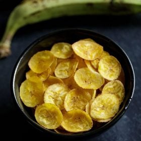 bowl of yellow banana chips with text layovers.