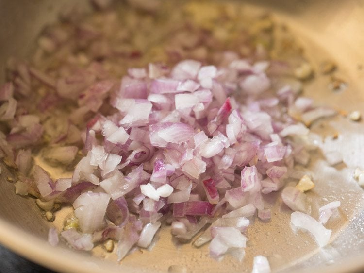 finely chopped onion added to pan for refried beans recipe. 