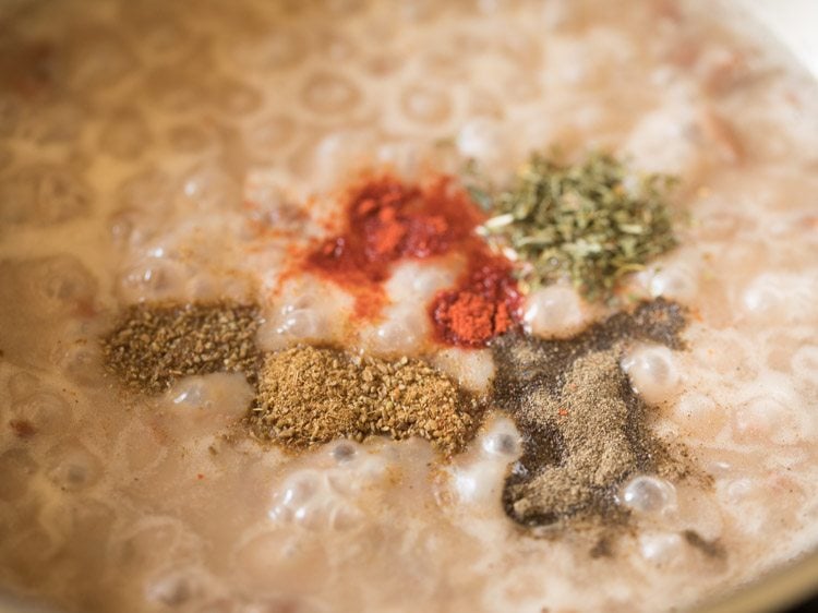 black pepper powder, dried oregano, red chili powder and cumin powder added mashed beans. 