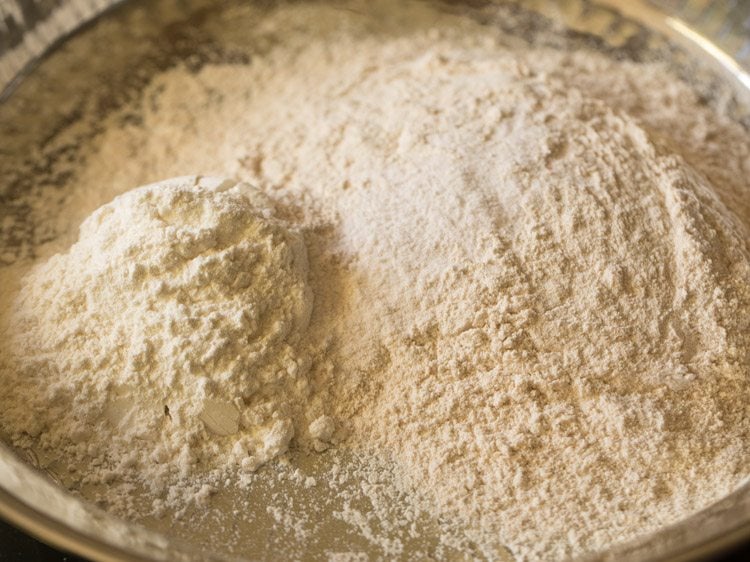 whole wheat flour, all purpose flour and salt added in a large bowl. 