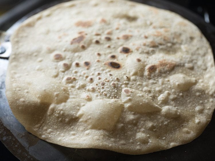 roasted rumali roti on a plate. 