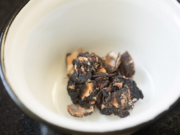 tamarind added to a bowl for vatha kuzhambu. 