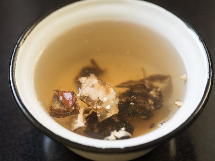 soaking tamarind in hot water for vatha kuzhambu. 