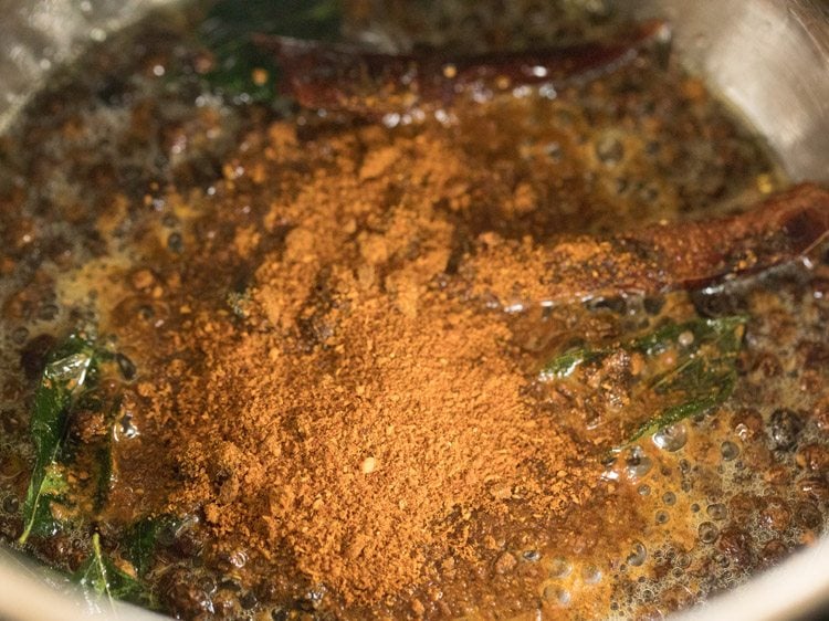 sambar powder added to the pan. 