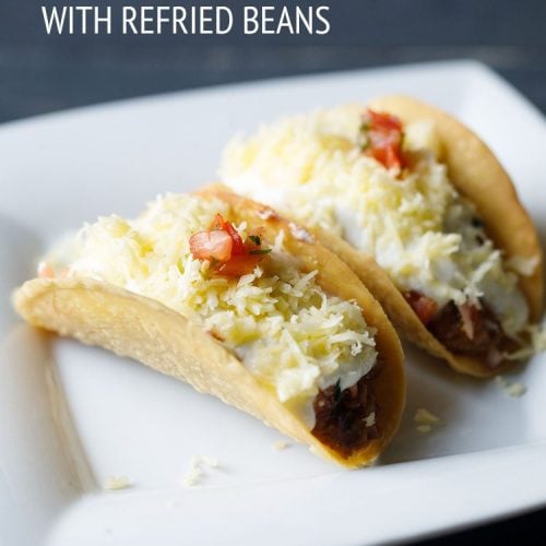 vegetarian tacos on a square white plate.