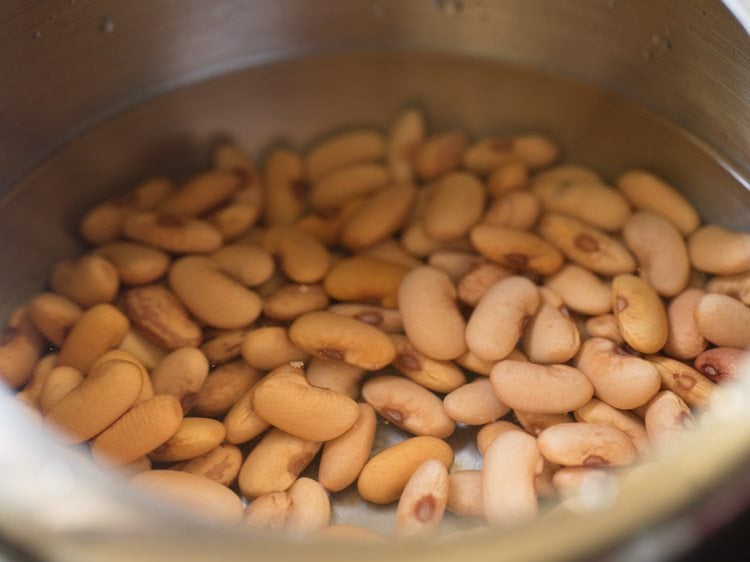 adding water to rajma for pressure cooking. 