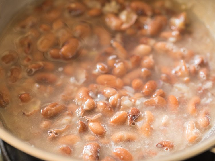 water added to beans to make refried beans. 