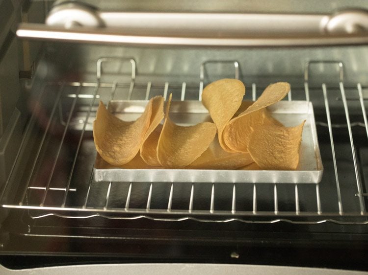 warming tortillas in the oven for making Mexican veg taco recipe.