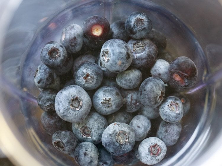 adding water in the blender jar 