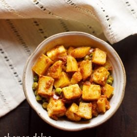 chanar dalna served in a white ceramic bowl with text layovers.