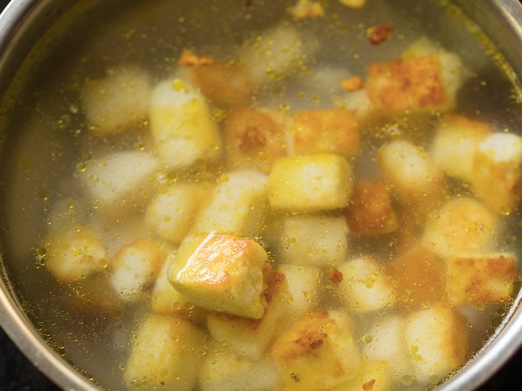 fried paneer cubes kept in lukewarm water. 