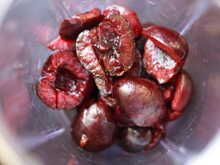 Chopped cherries in a blender.