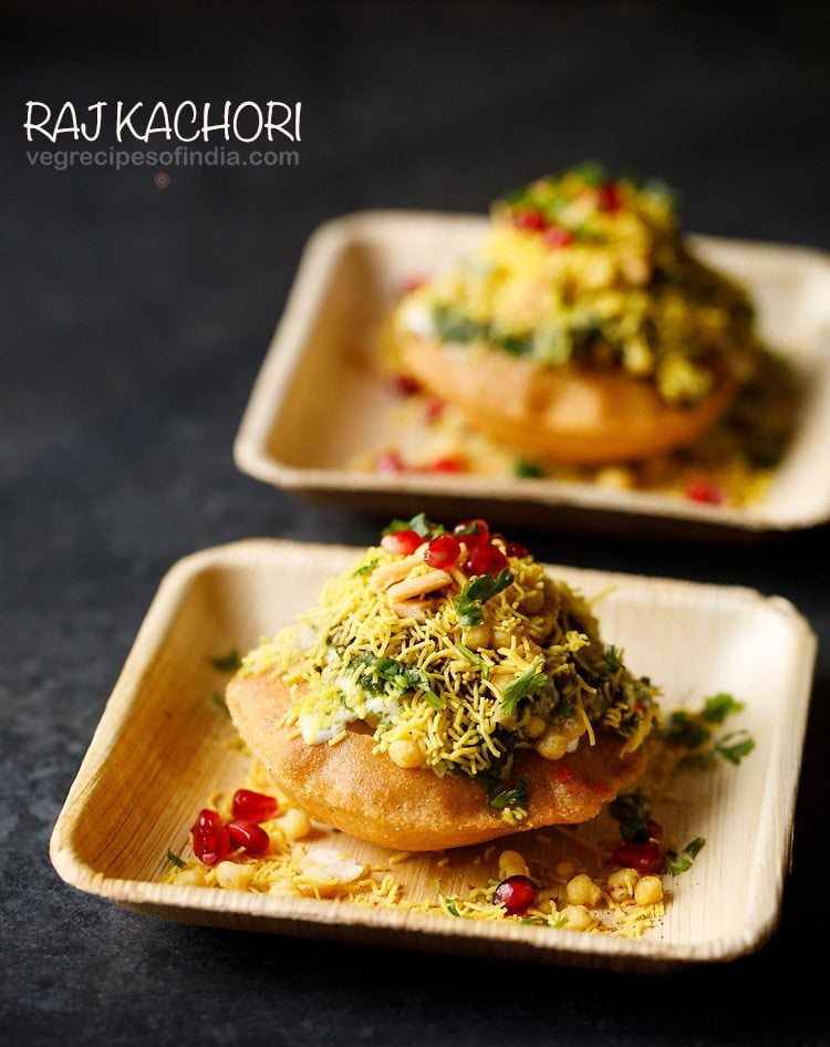 raj kachori served on 2 wooden plates with text layover.