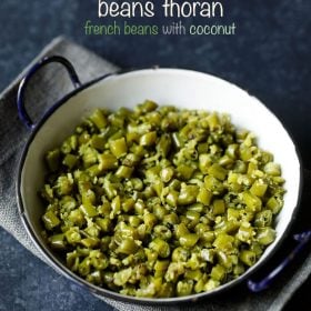 beans thoran served in a black rimmed pot with text layovers.