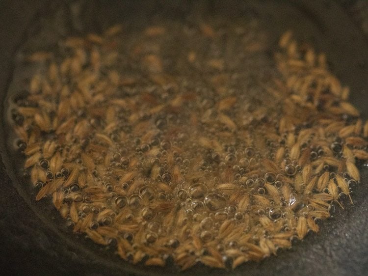 cumin seeds crackling in hot coconut oil. 