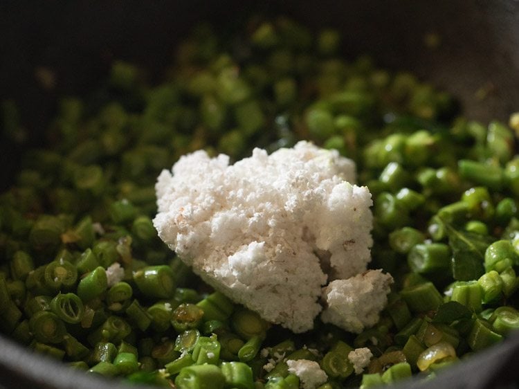 grated fresh coconut added to the pan. 