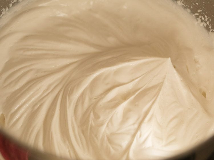 whipping cream till stiff peaks are formed 