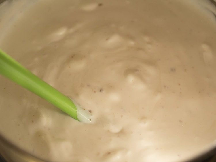 folding the praline ice cream mixture well