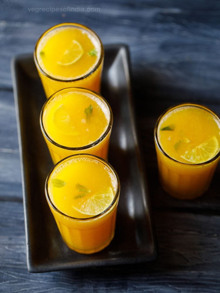 a serving tray filled with garnished glasses of my easy fruit punch recipe.