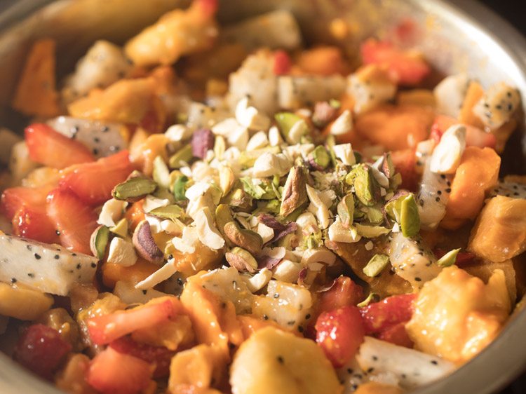 chopped cashewnuts, almonds and pistachios added to the mixed fruits. 