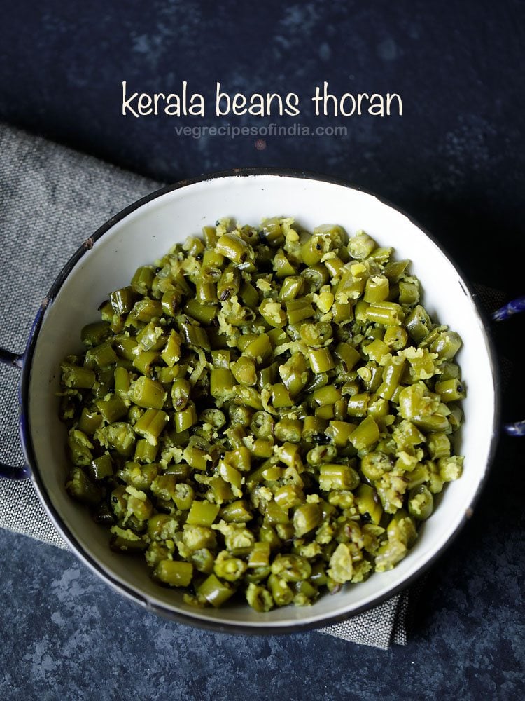 beans thoran served in a black rimmed pot with text layovers. 