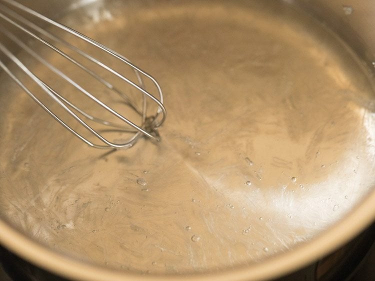 whisking agar agar into hot water for making vegetarian panna cotta without gelatin