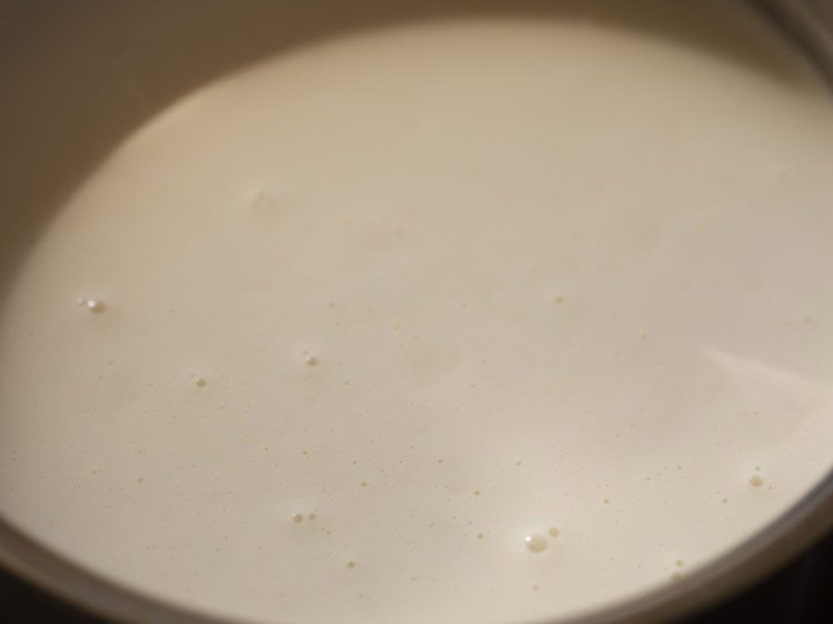 cream mixture is barely at a simmer before removing from heat
